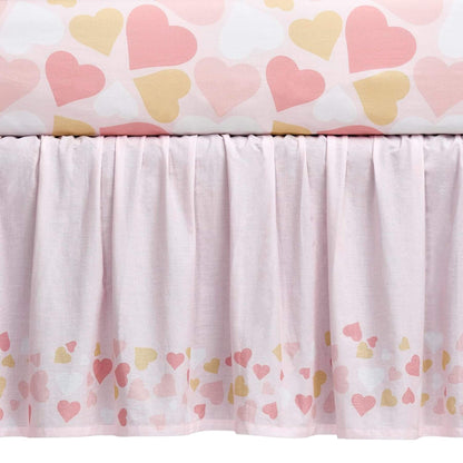 Crib skirt with heart pattern on a white background