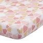 Fitted sheet with pink and yellow heart pattern on a white background