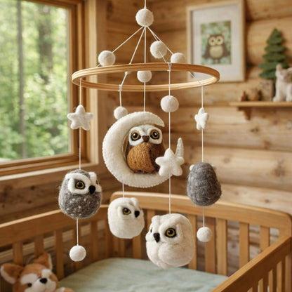 Wooden crib with Ganapati Crafts Co. Baby Mobile - Owl in a cozy room.