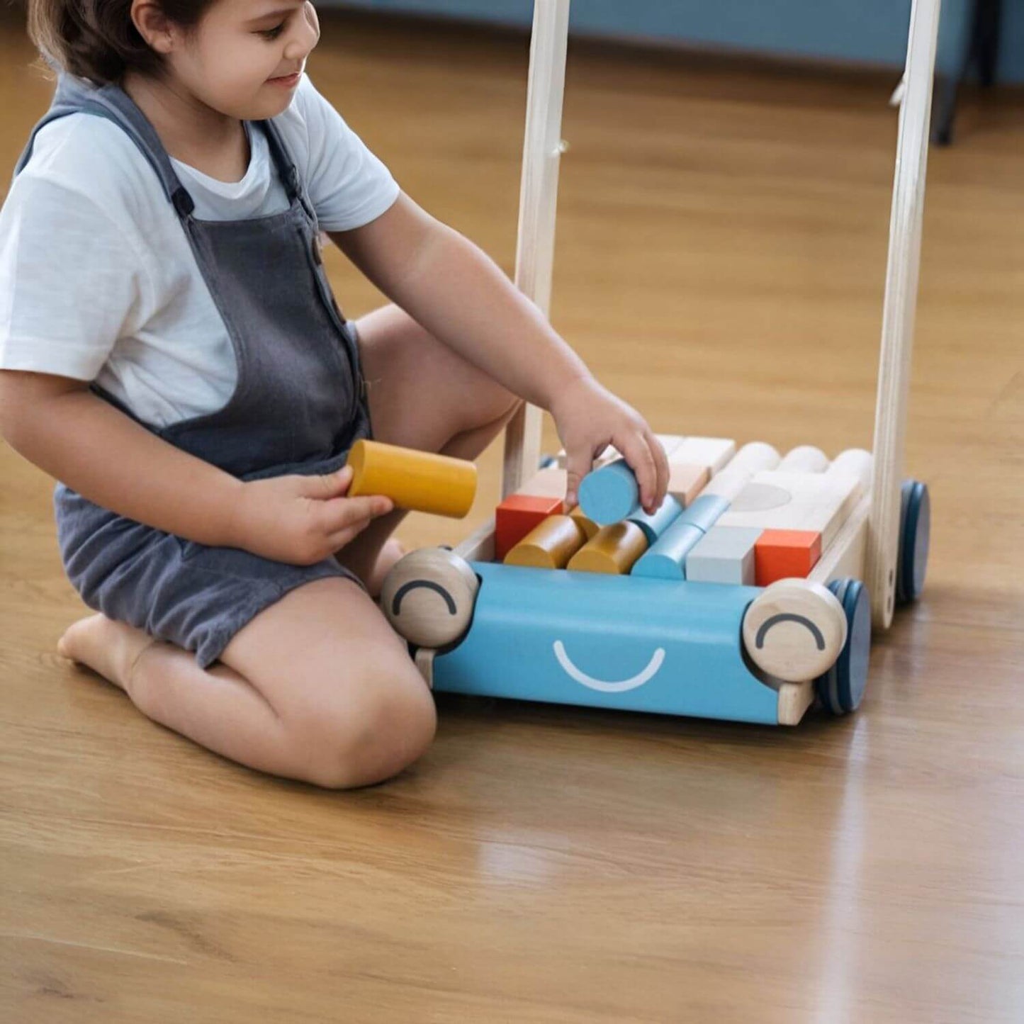 Girl Playing PlanToys Baby Walker - Orchard