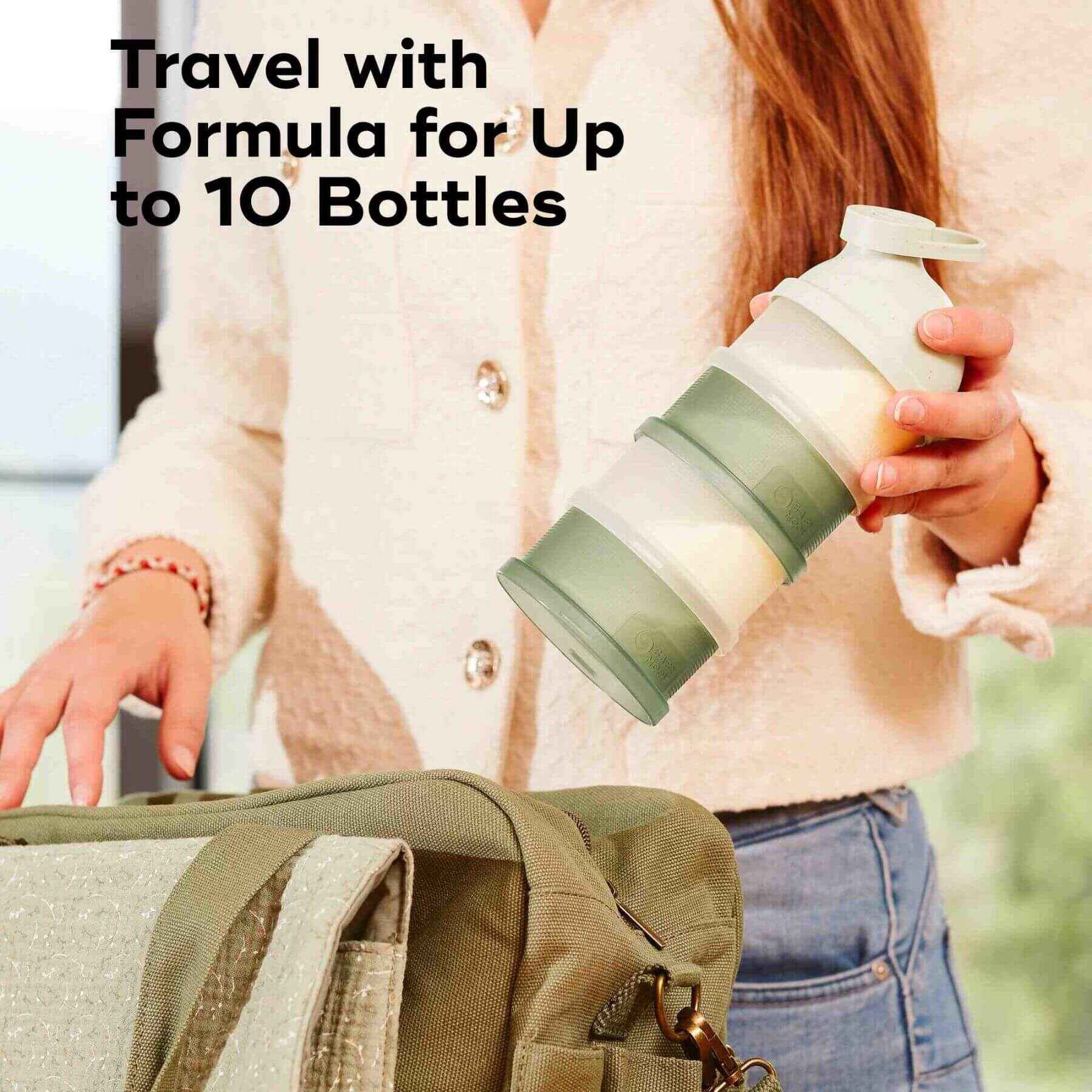 Hand Holding Babydose Formula Dispenser