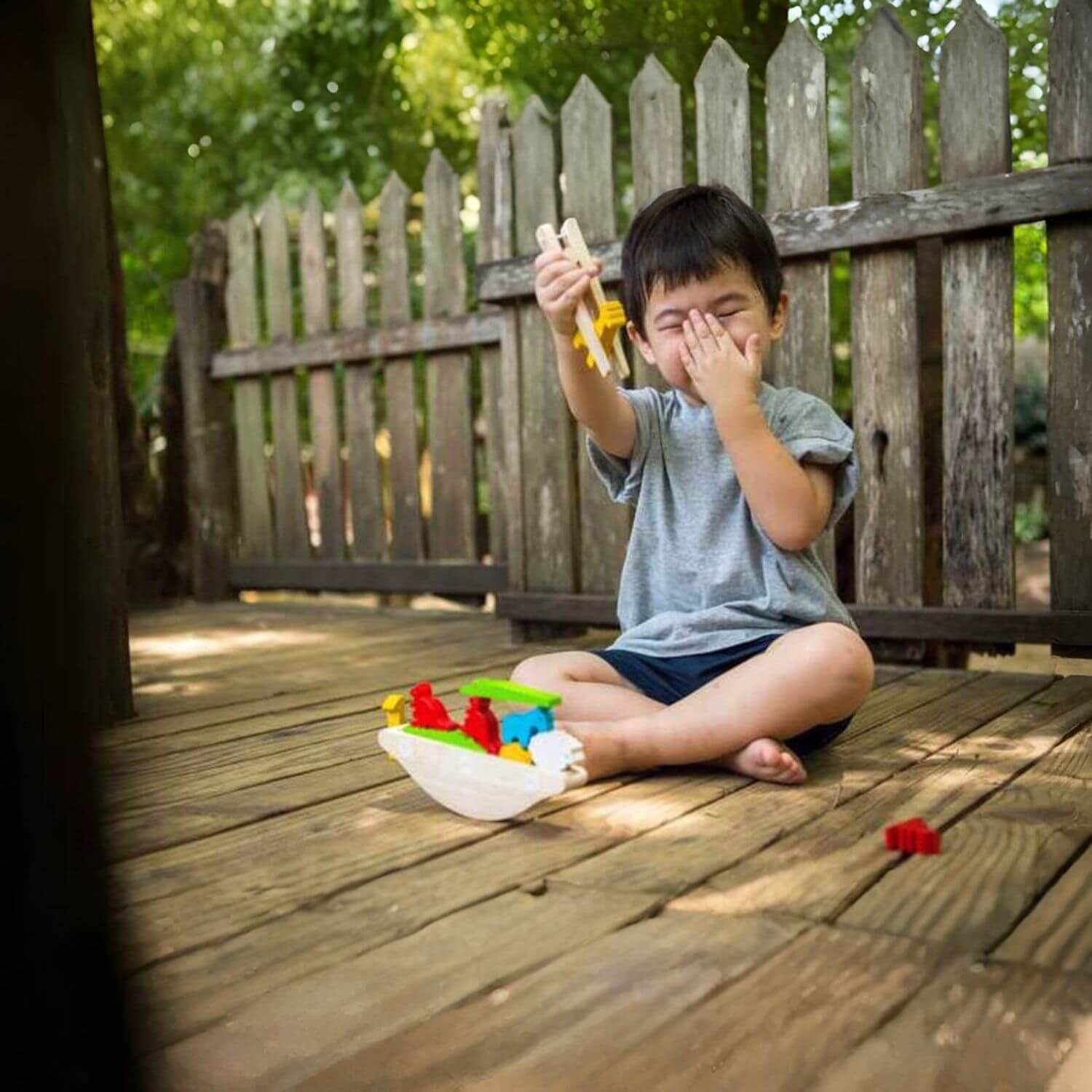 Boy Playing PlanToys Balancing Boat