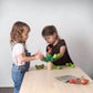 Two Girls Playing PlanToys Balancing Cactus