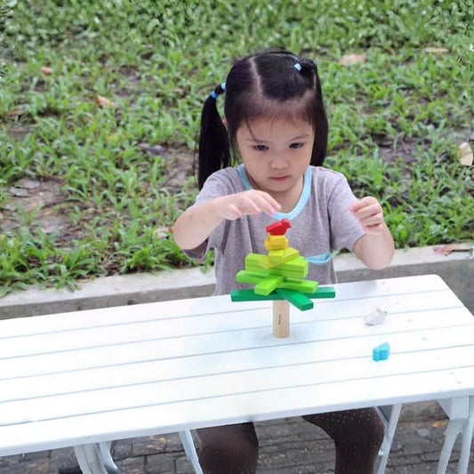 Girl Playing PlanToys Balancing Tree