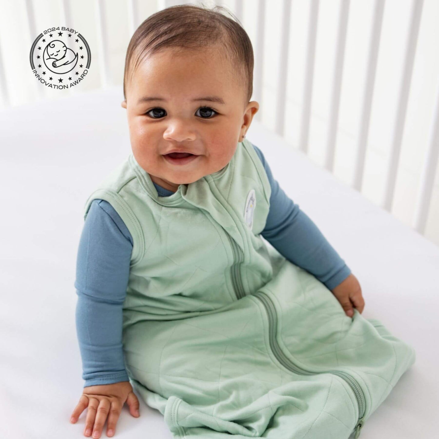 Baby in Bamboo Classic Sleep Sack - Sage, sitting in a crib