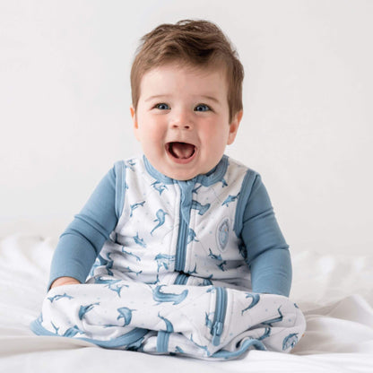 Kid in Bamboo Classic Sleep Sack - Shark, sitting on bed