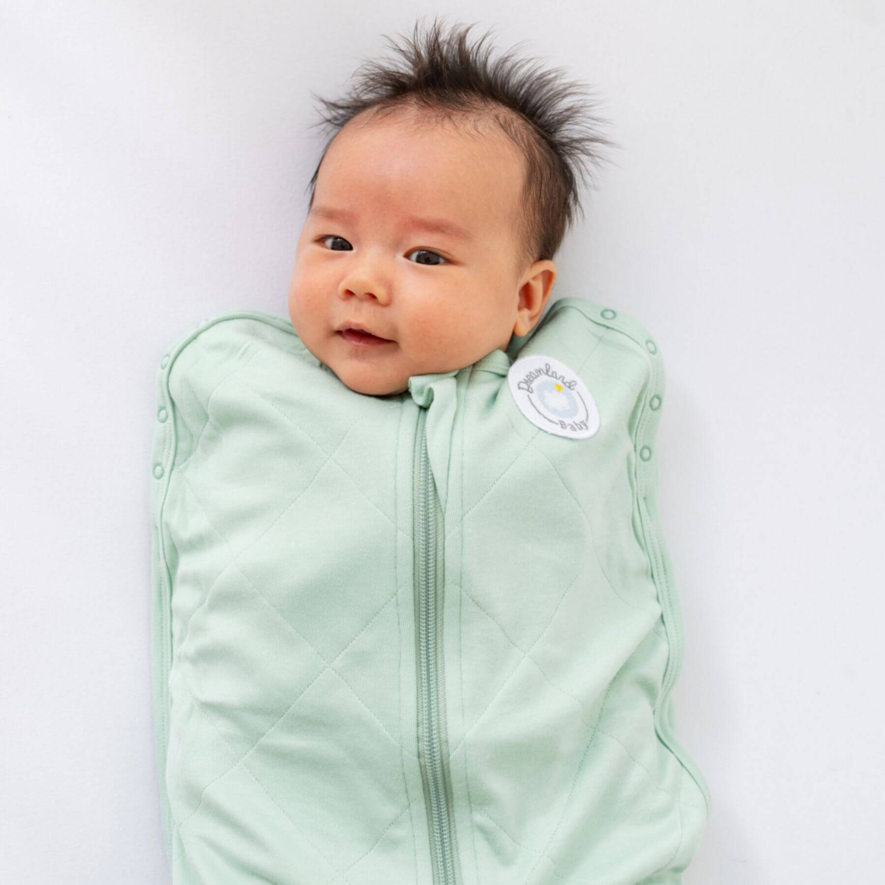 Baby wearing Dreamland Baby Bamboo Classic Swaddle - Sage