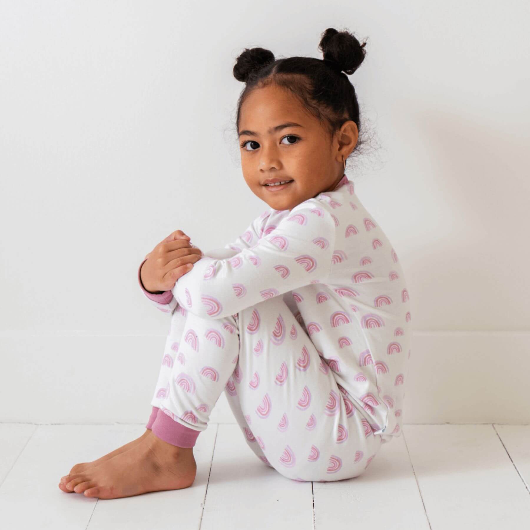 Baby wearing Dreamland Baby Toddler/Kids Bamboo Pajamas - Pink Rainbow