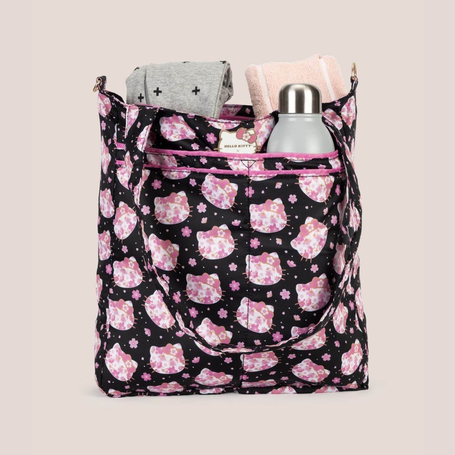 Be Light Cherry Blossoms filled with items on a beige background