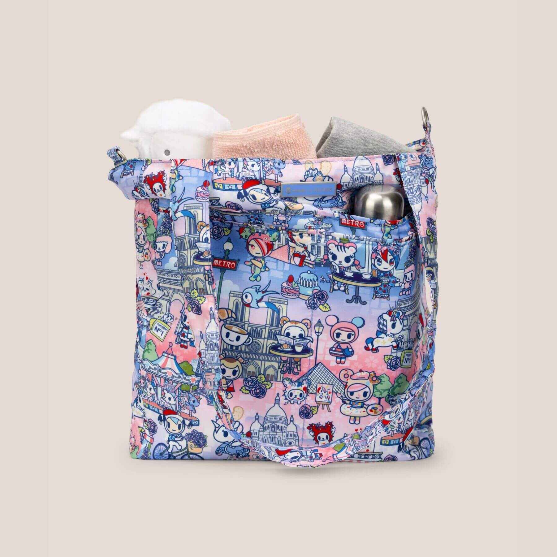 tokidoki Be Light Tote Bag -  C'est la vie à Paris with baby items on a light gray background