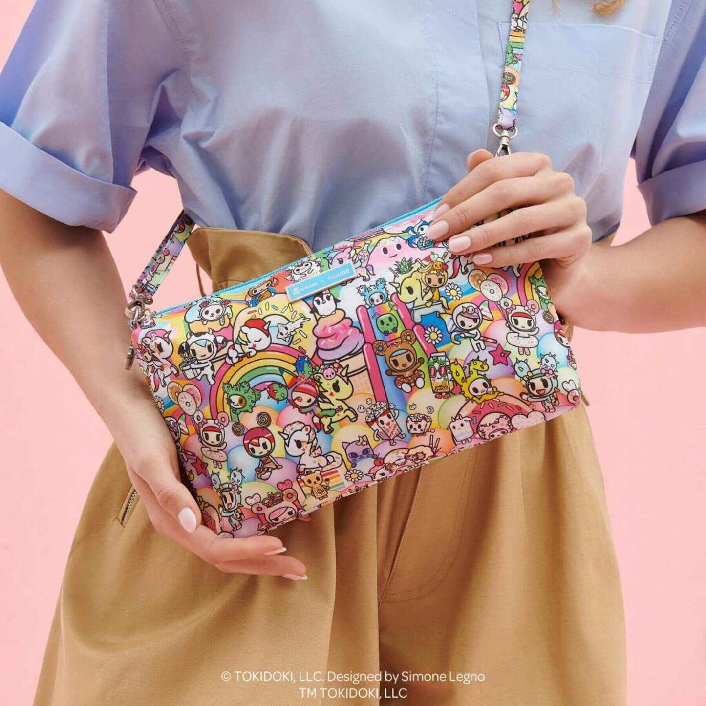 Woman carrying tokidoki Be Quick Clutch - 20th Anniversary Celebration