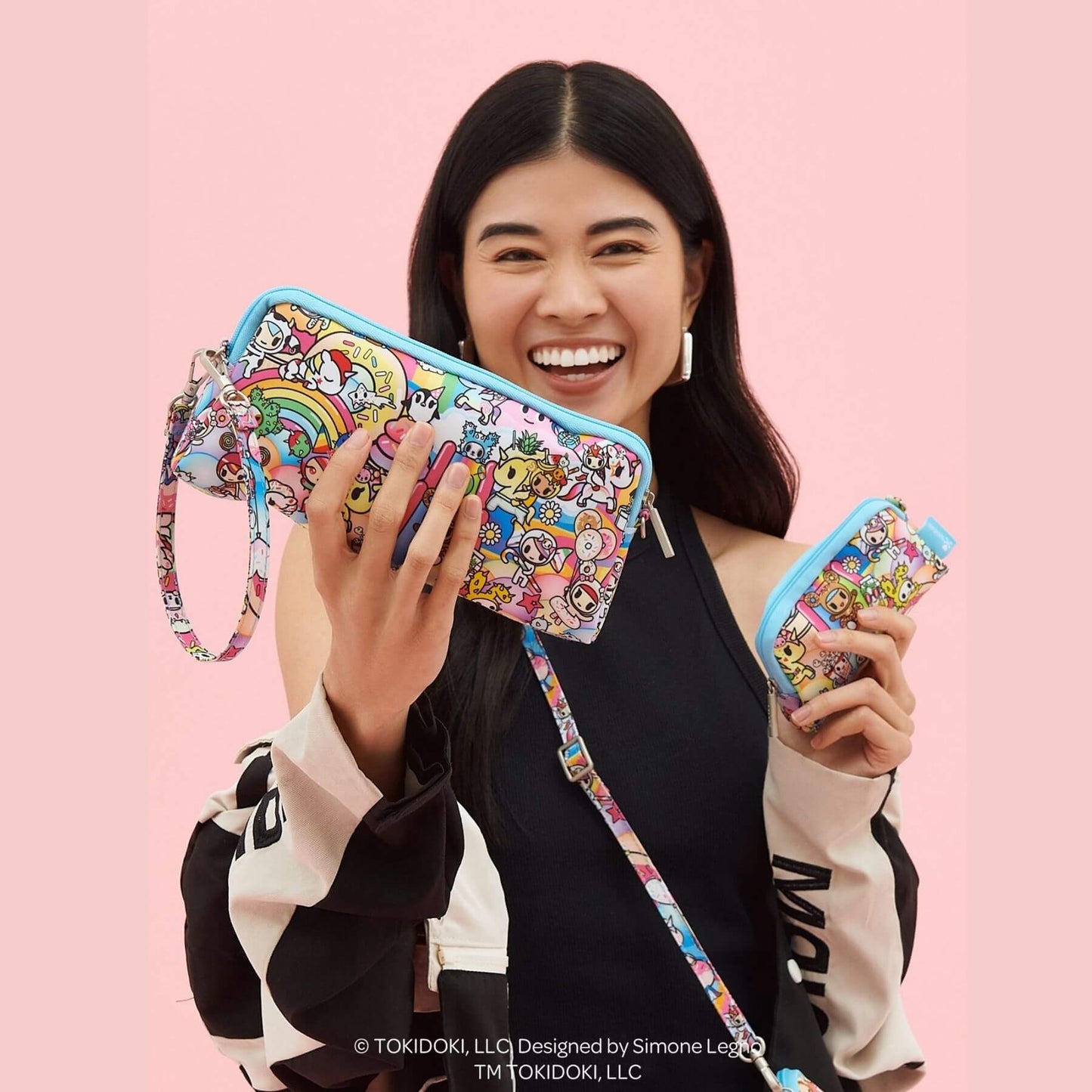 Woman holding tokidoki Be Set 3-Piece Pouch Set