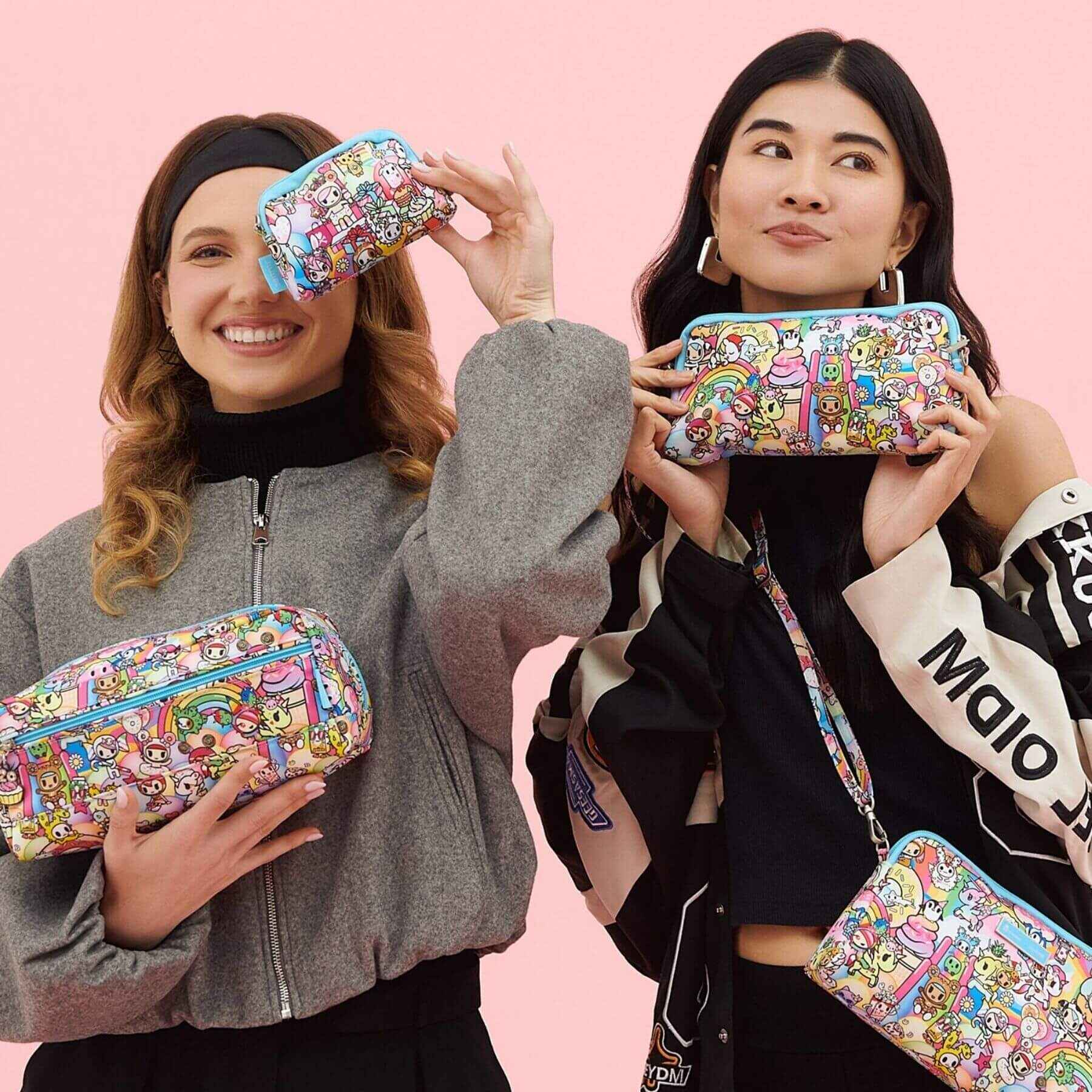 Two women holding tokidoki Be Set 3-Piece Pouch Set