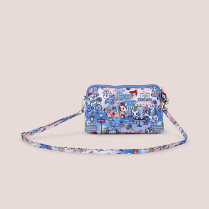 Multicolored wristlet with cartoon character design on a beige background