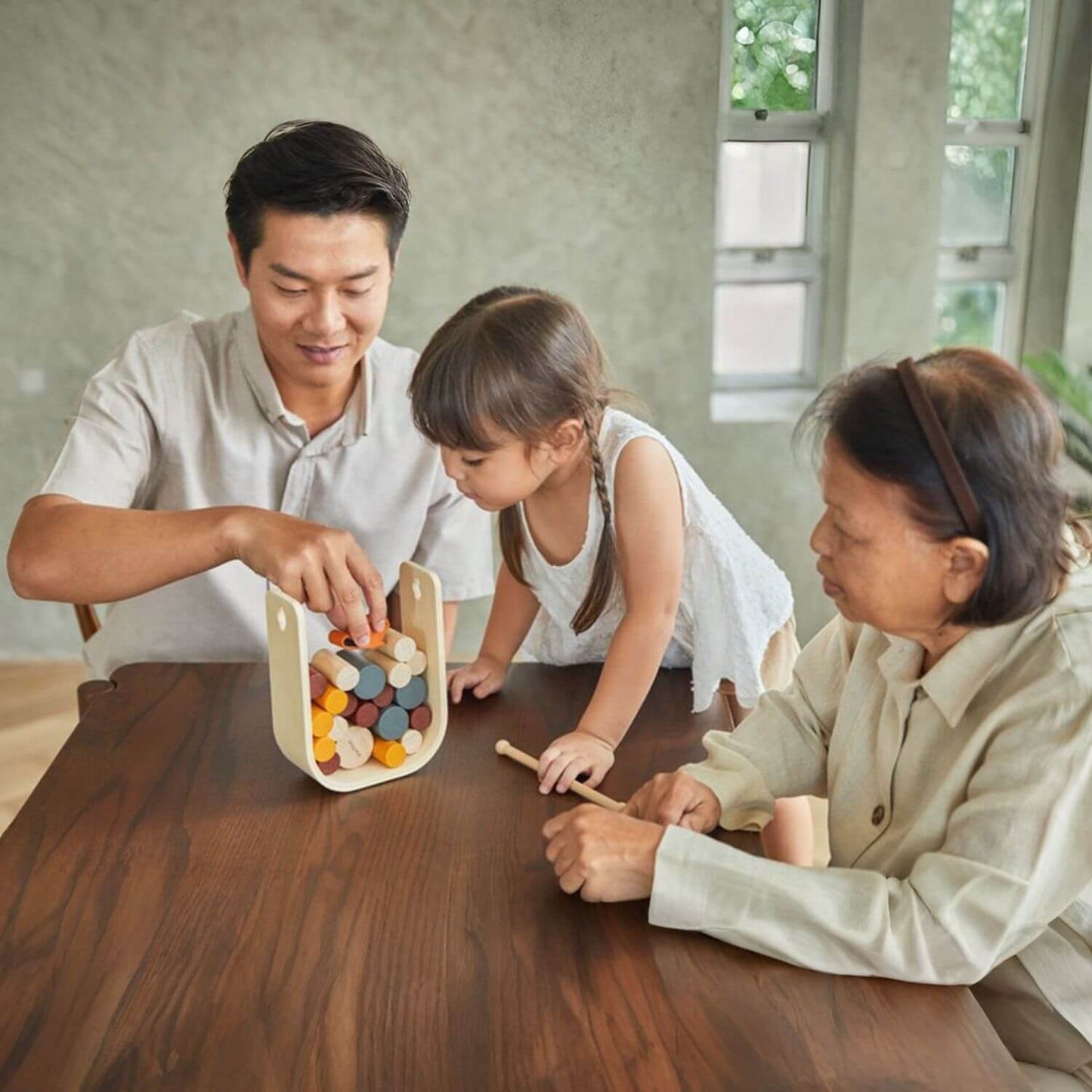 Family Playing PlanToys Beaver Tumble