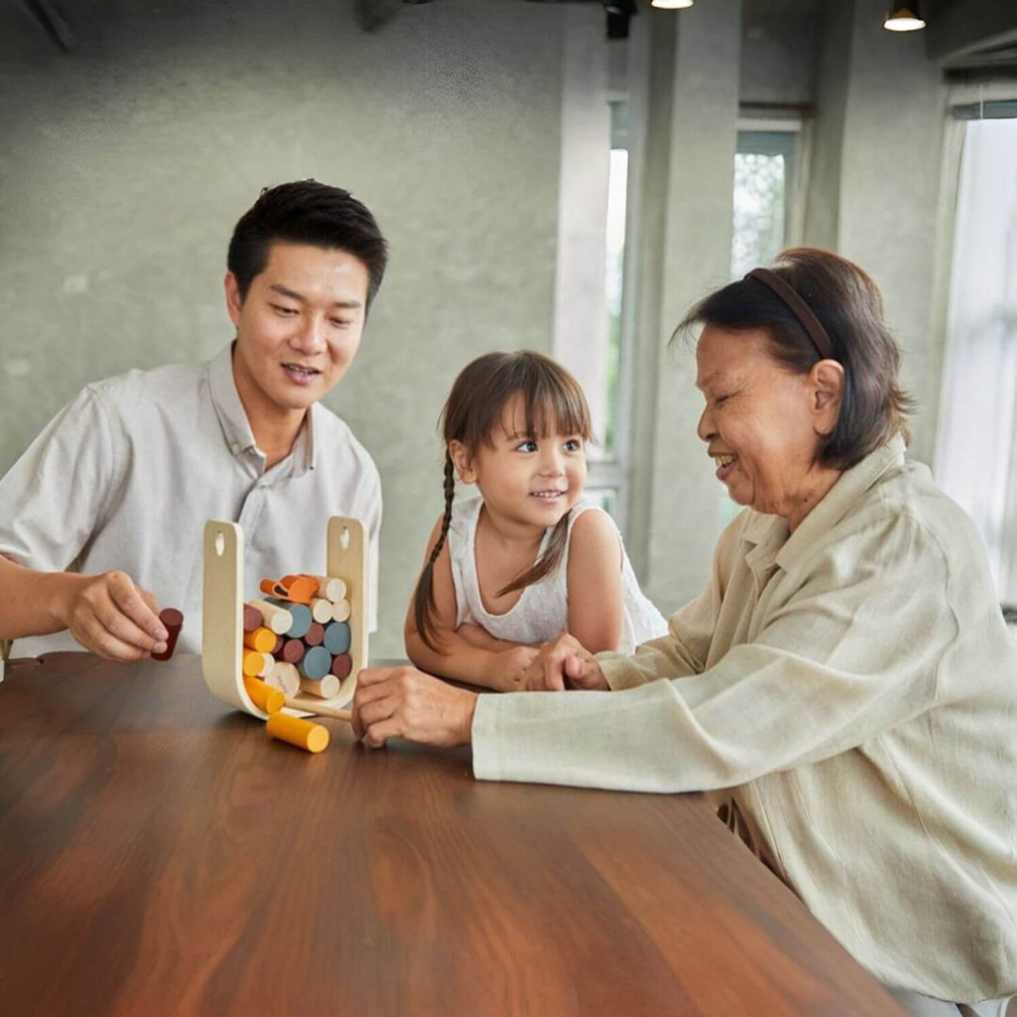 Family Playing PlanToys Beaver Tumble