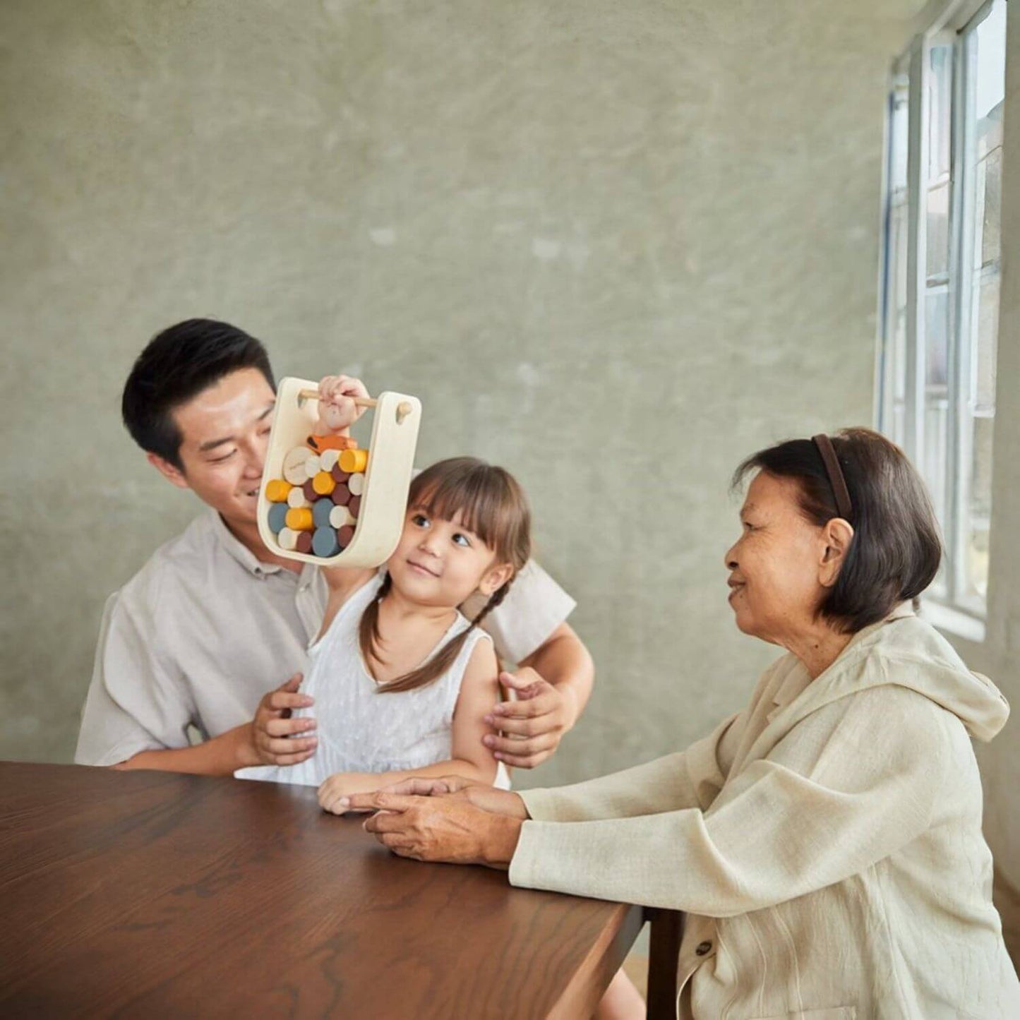 Family Playing PlanToys Beaver Tumble