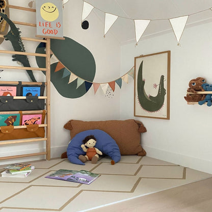 Children's room with a ladder, books, and toys on Eeveve Beni Autumn Gold Play Mat