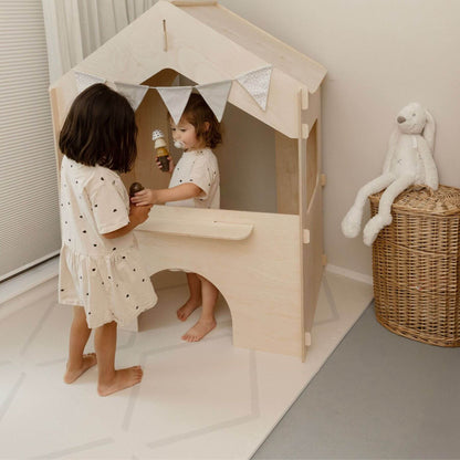 Two kids playing play house standing on Eeveve Beni Cashmere Play Mat