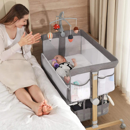 Baby Using Besrey 3-in-1 Newborn Bedside Crib with Mobile Toy Hanger