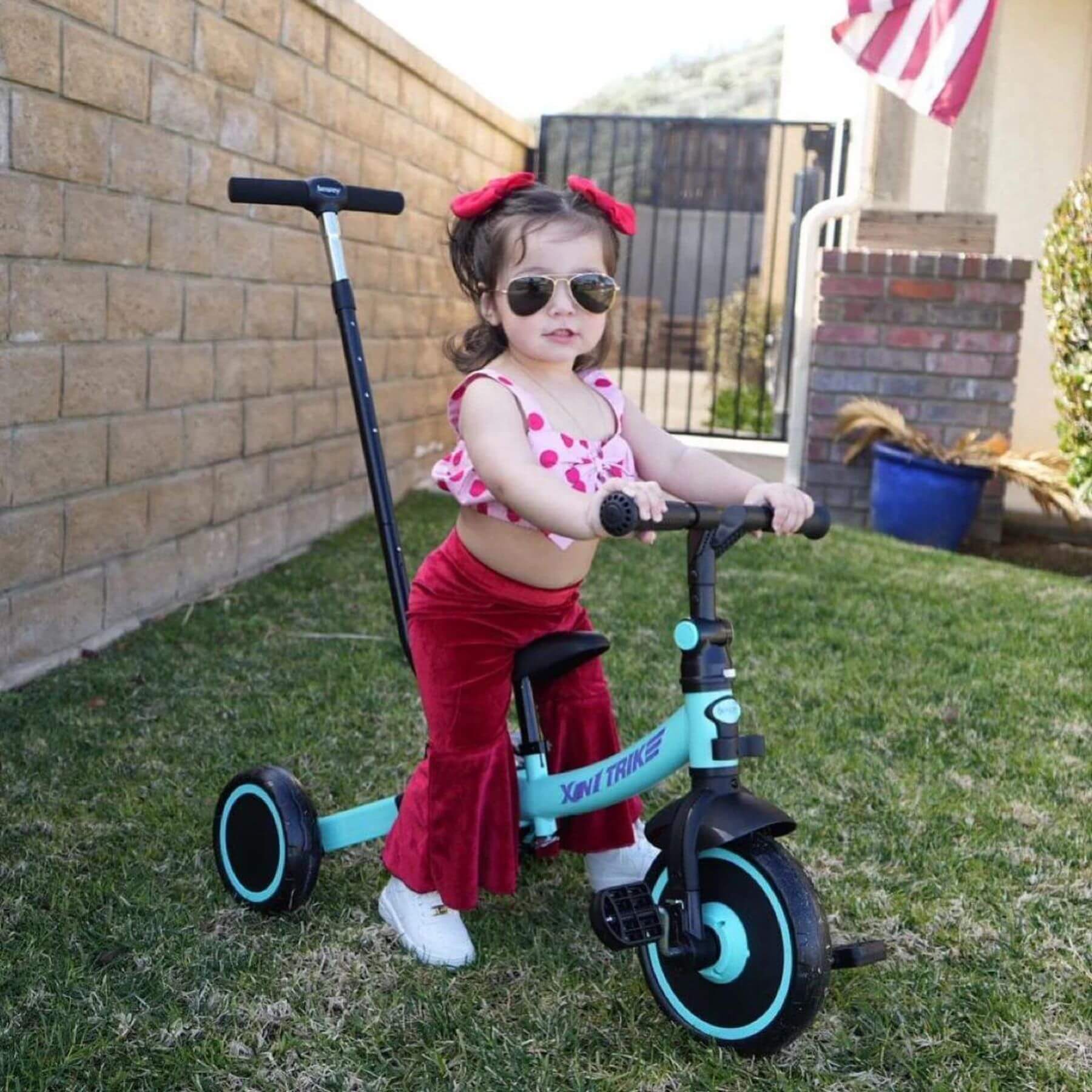 Girl Riding Besrey Toddler 7-in-1 Trike Tricycle Green