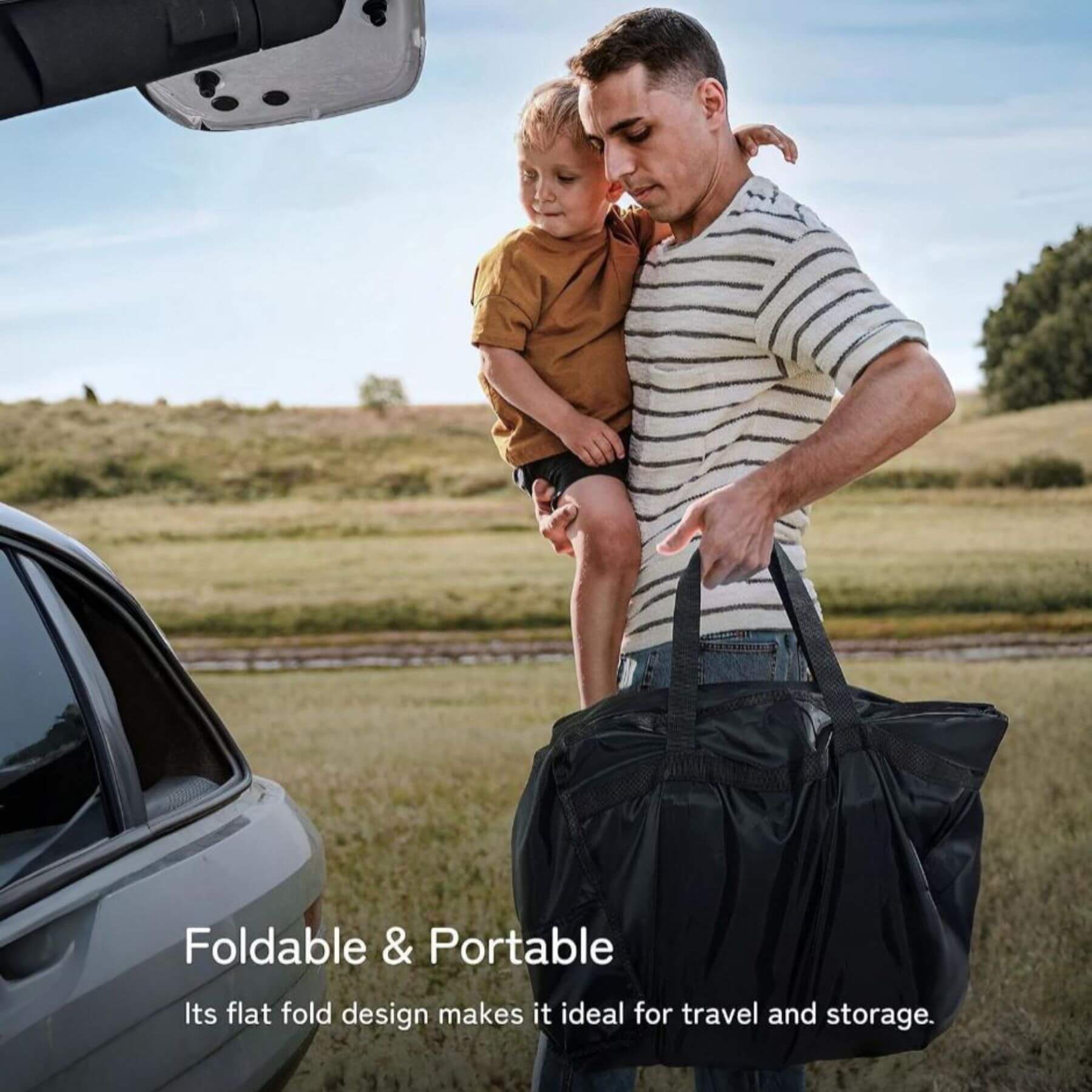 Man holding a child and a black duffel bag with text about the bag's portability.
