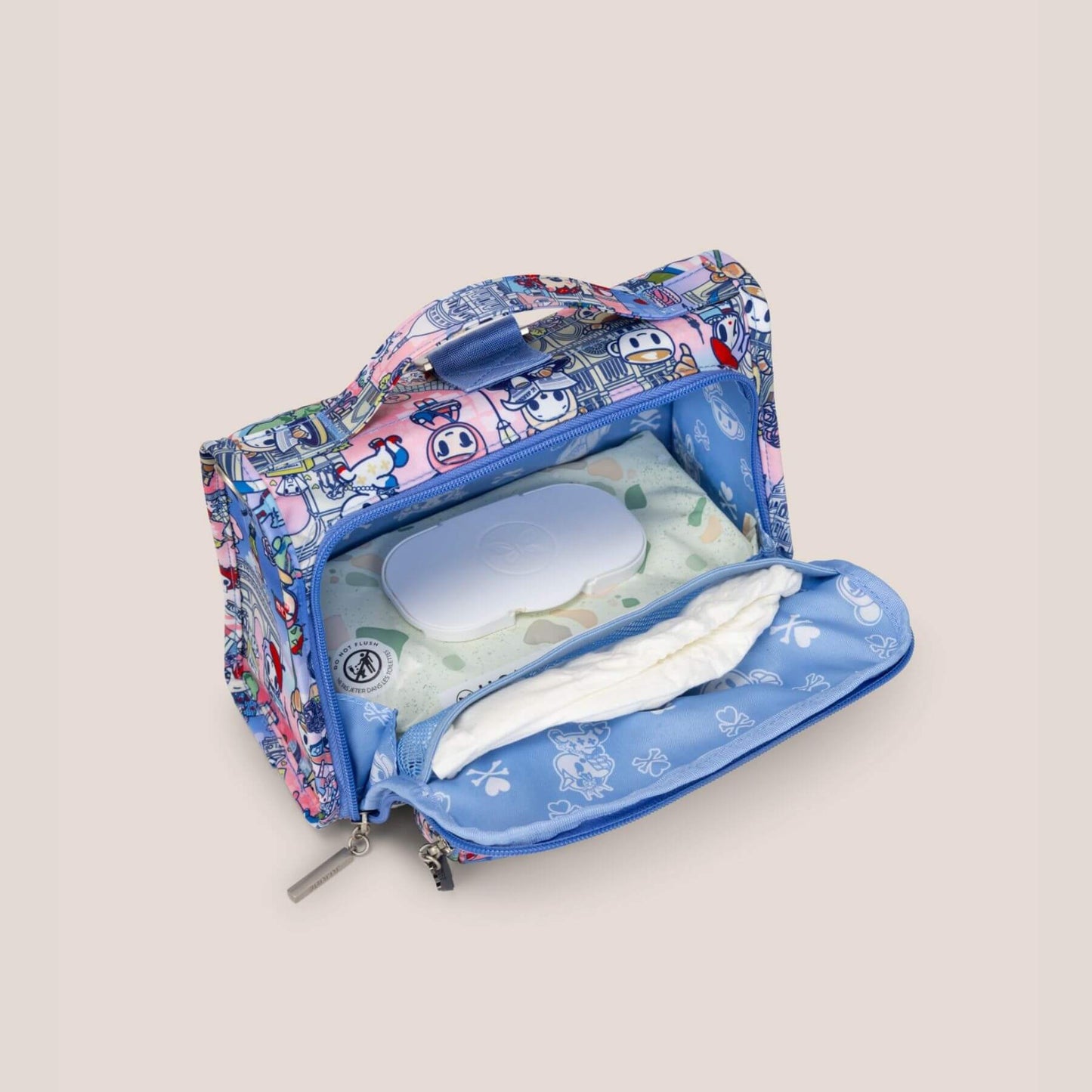 tokidoki The Bestie Small Messenger Handbag - C'est la vie à Paris with items on a light beige background