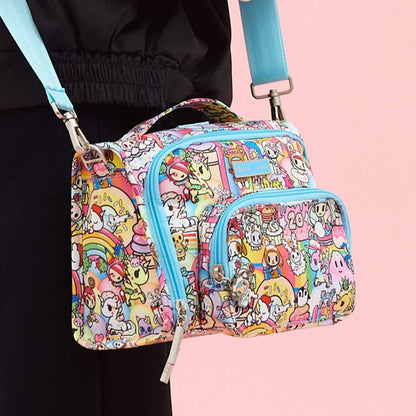 tokidoki The Bestie Small Messenger Handbag held by a person on a pink background