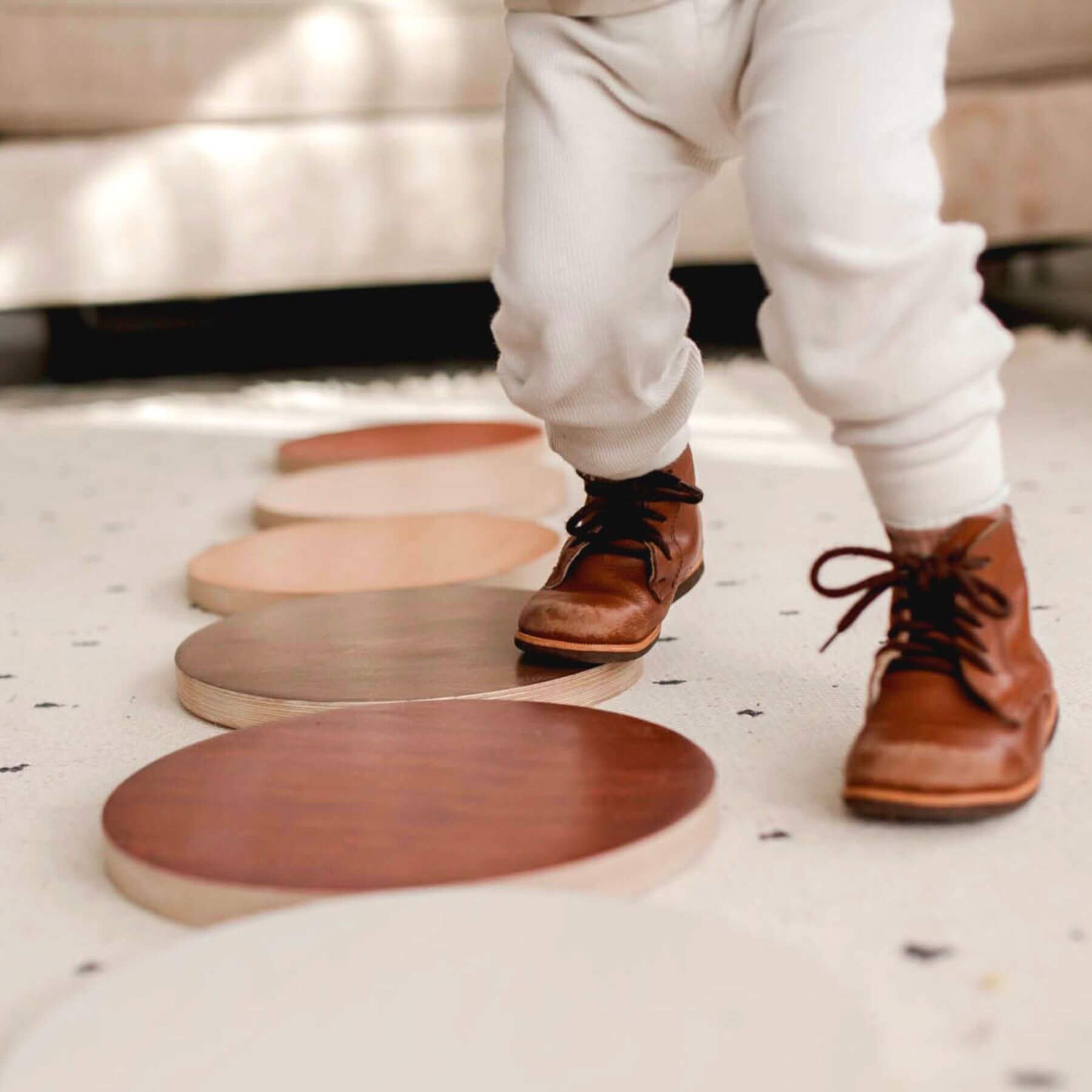 Person stepping on Bunny Hopkins Stepping Stones in a modern interior setting.