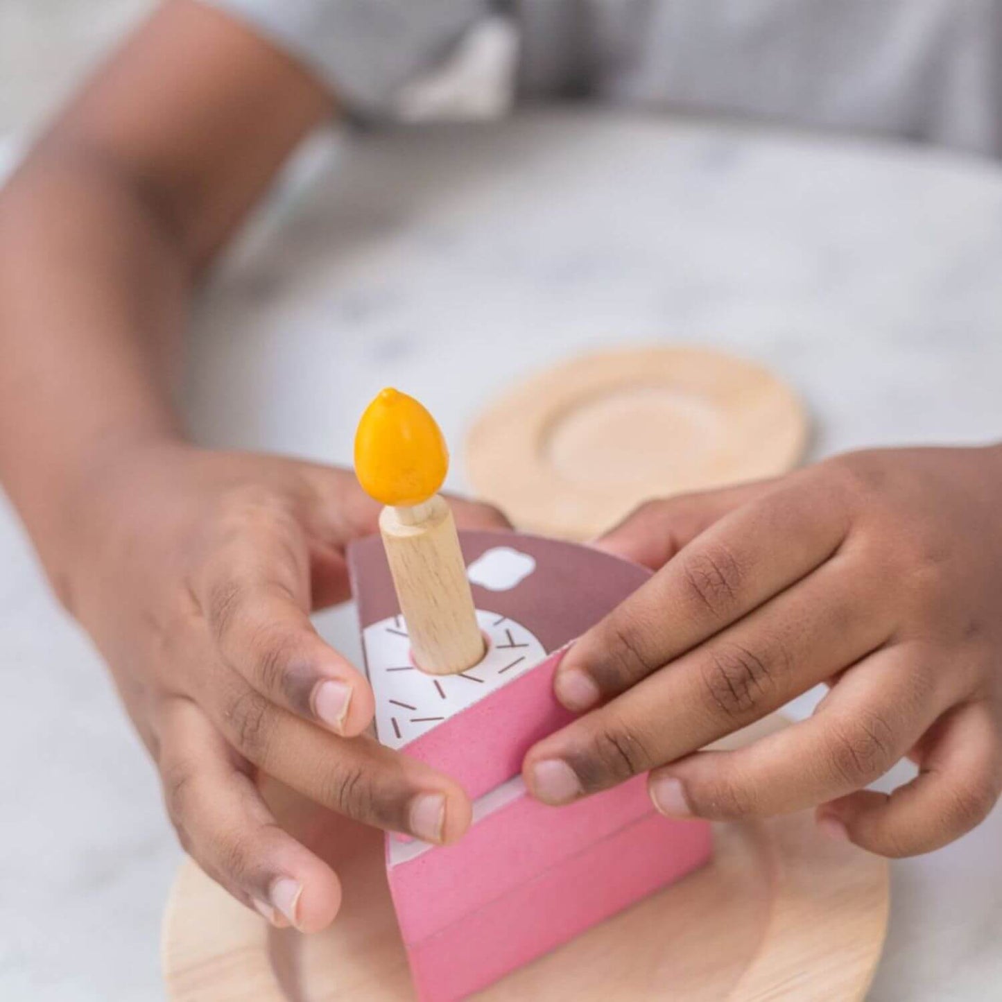 Playing PlanToys Birthday Cake Set