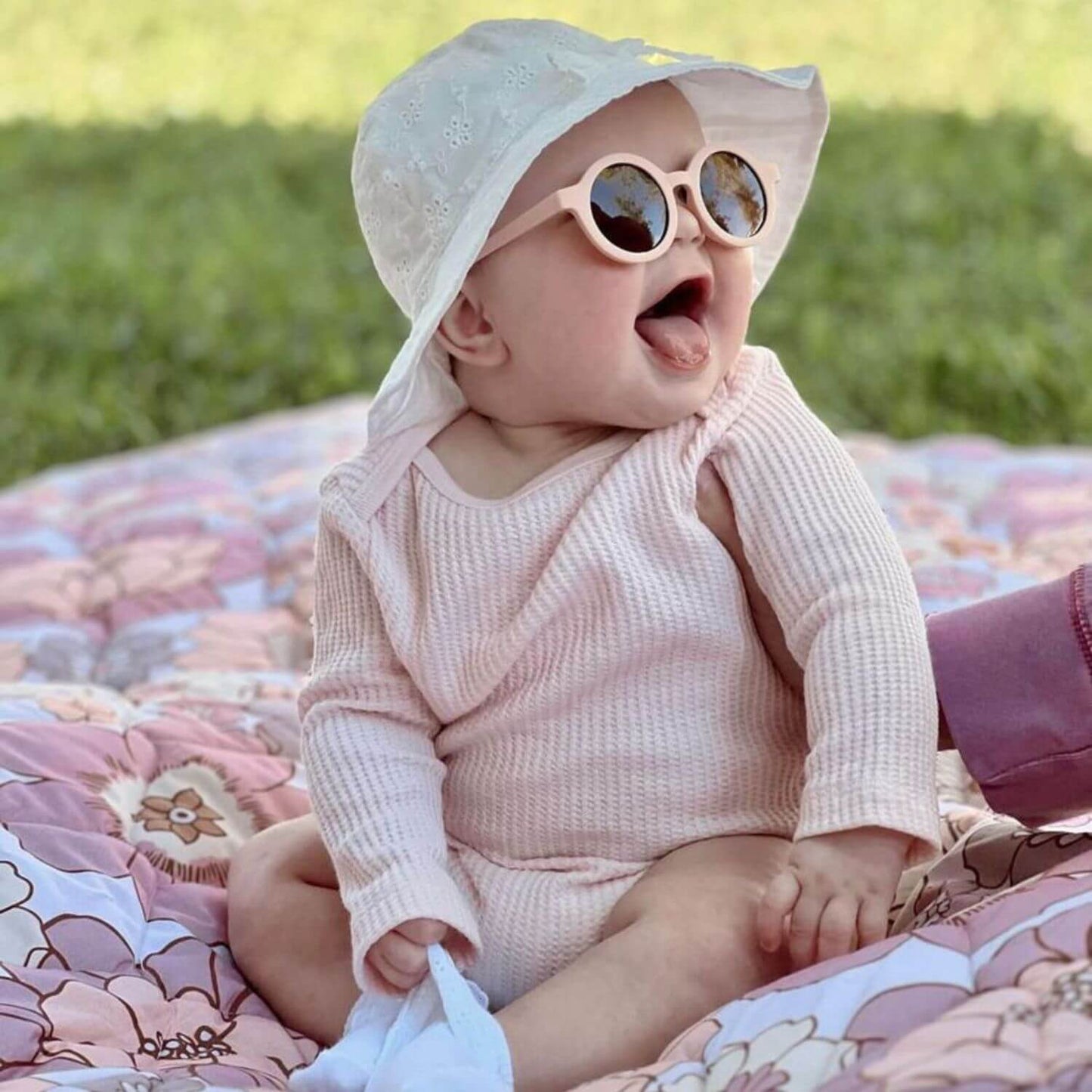Baby sitting on Toki Kids Blooms Picnic Blanket outdoor