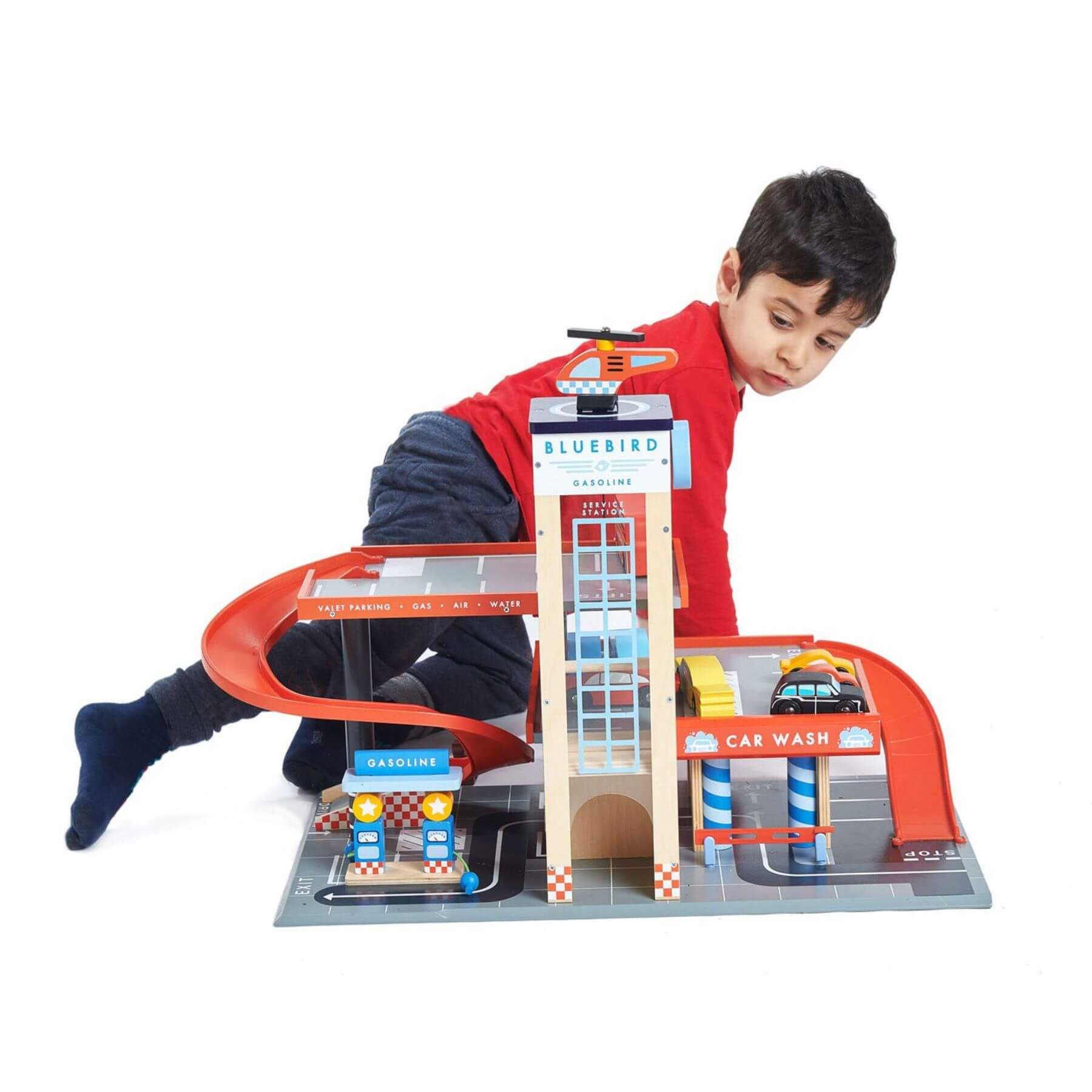 Child playing with Tender Leaf Blue Bird Service Station on a white background