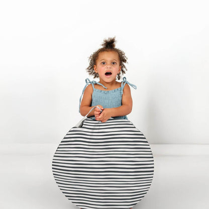 Girl holding a stripe round item