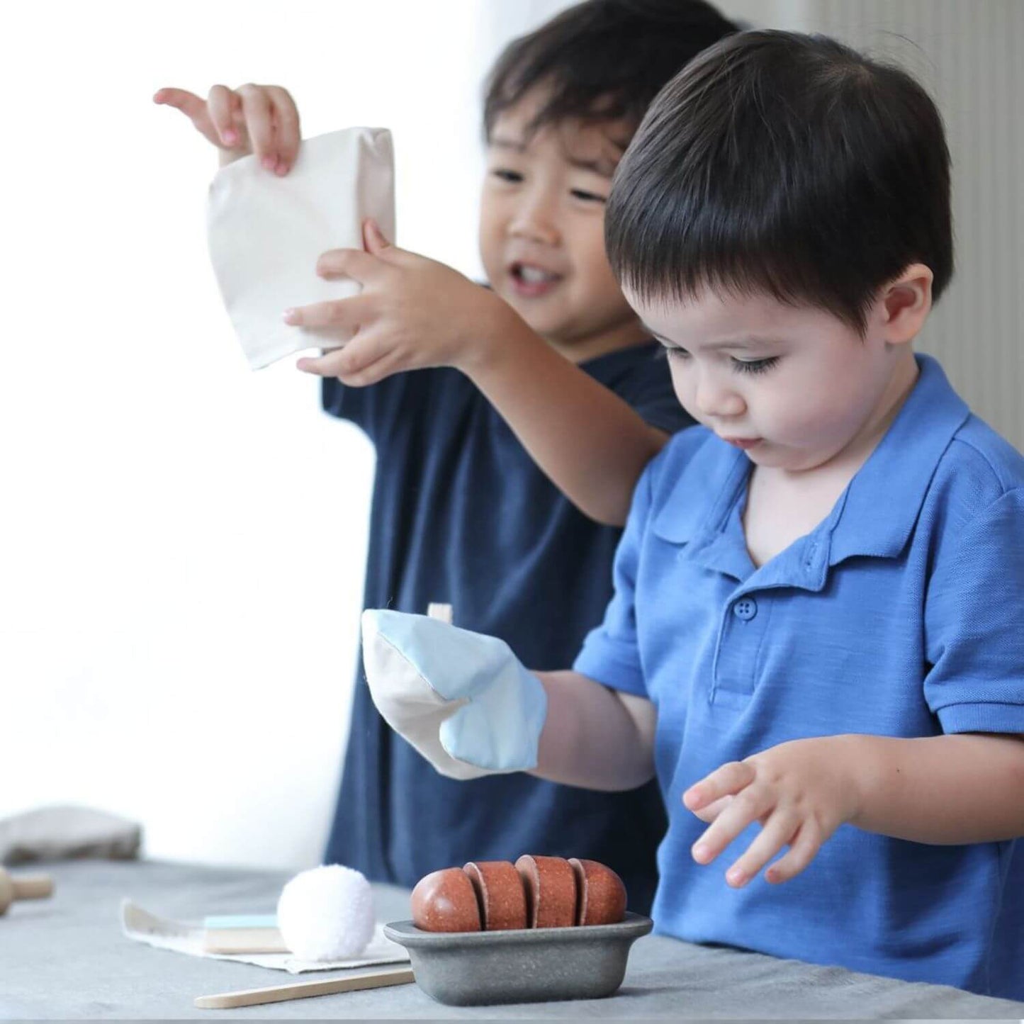 Kids Playing PlanToys Bread Loaf Set