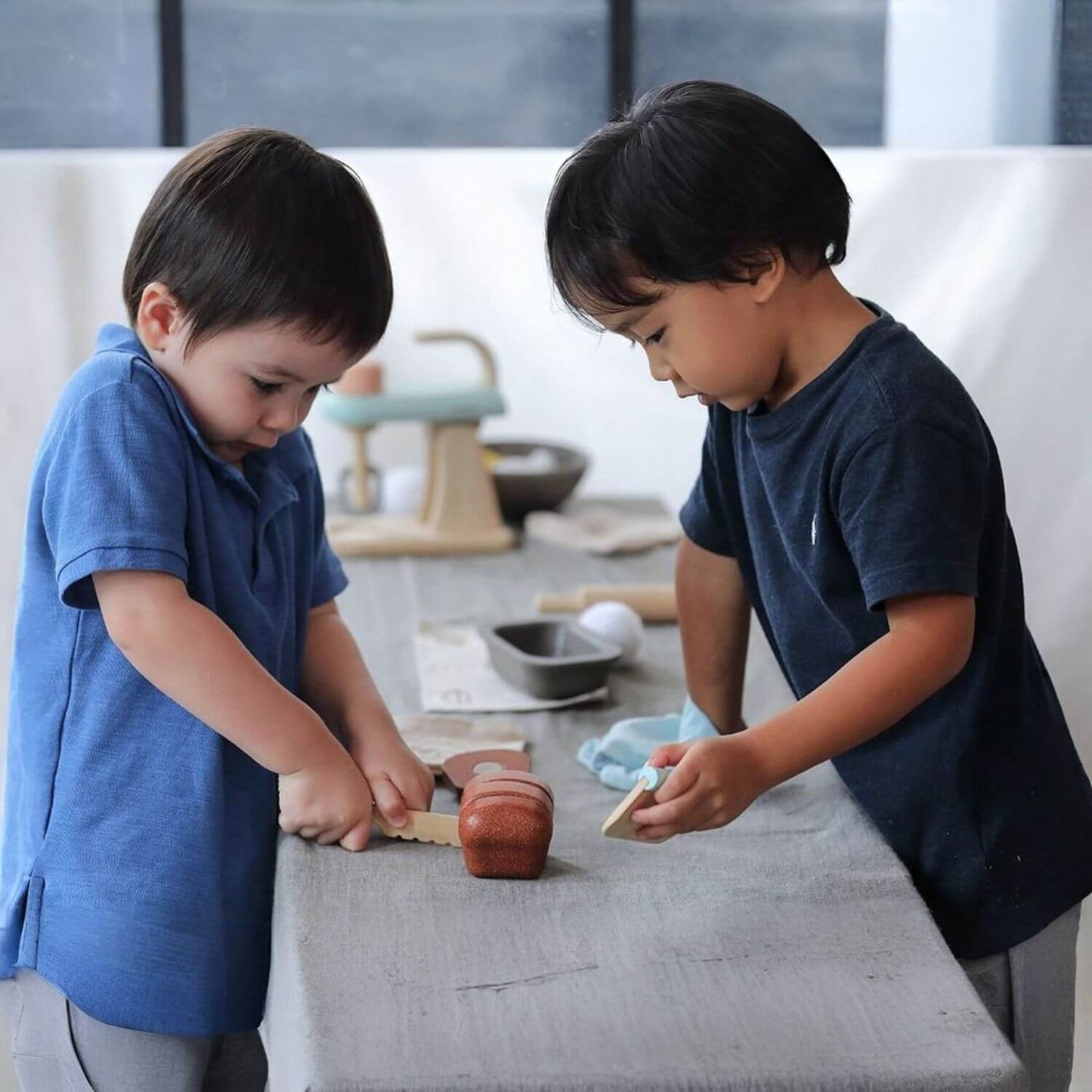 Kids Playing PlanToys Bread Loaf Set