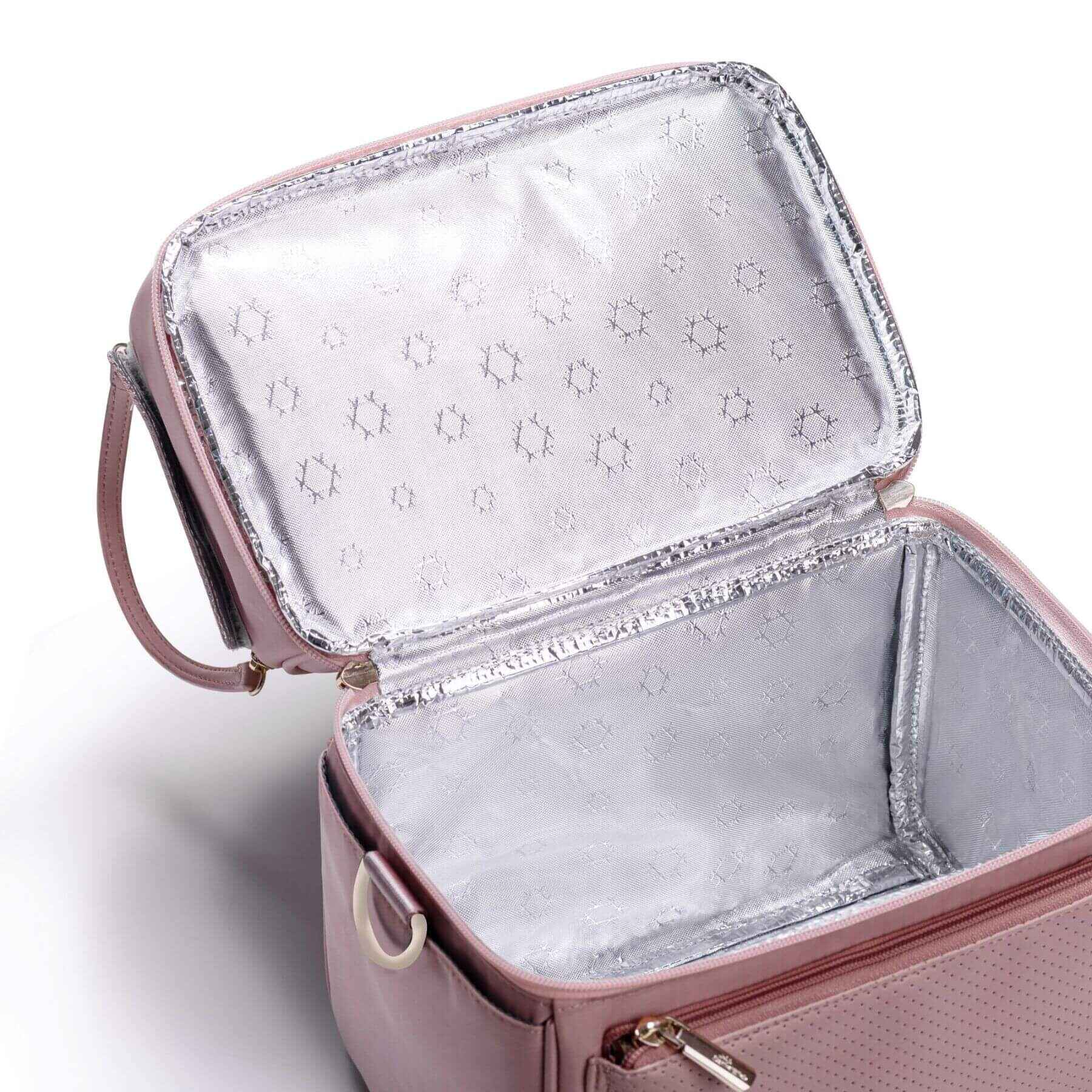 Pink insulated lunch bag with silver interior on a white background
