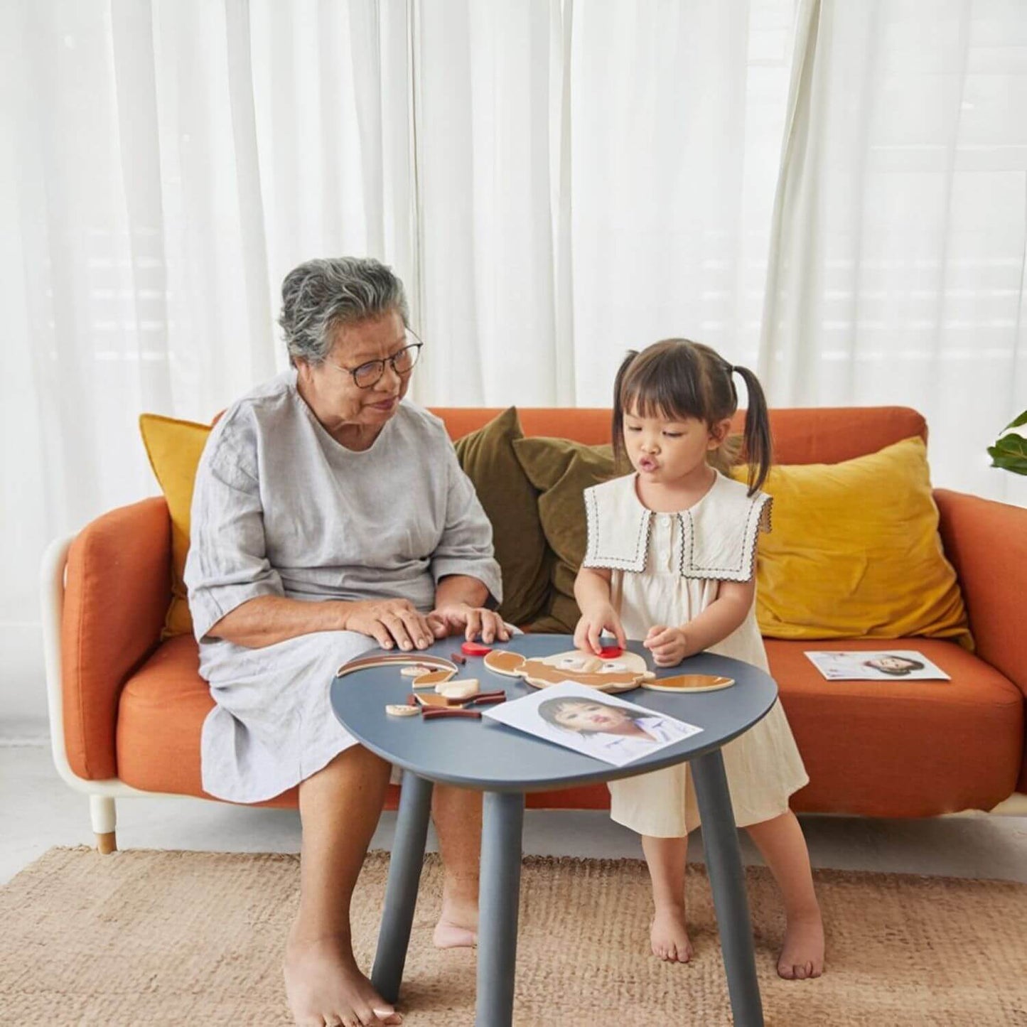 Grandma & Girl Playing PlanToys Build A Face