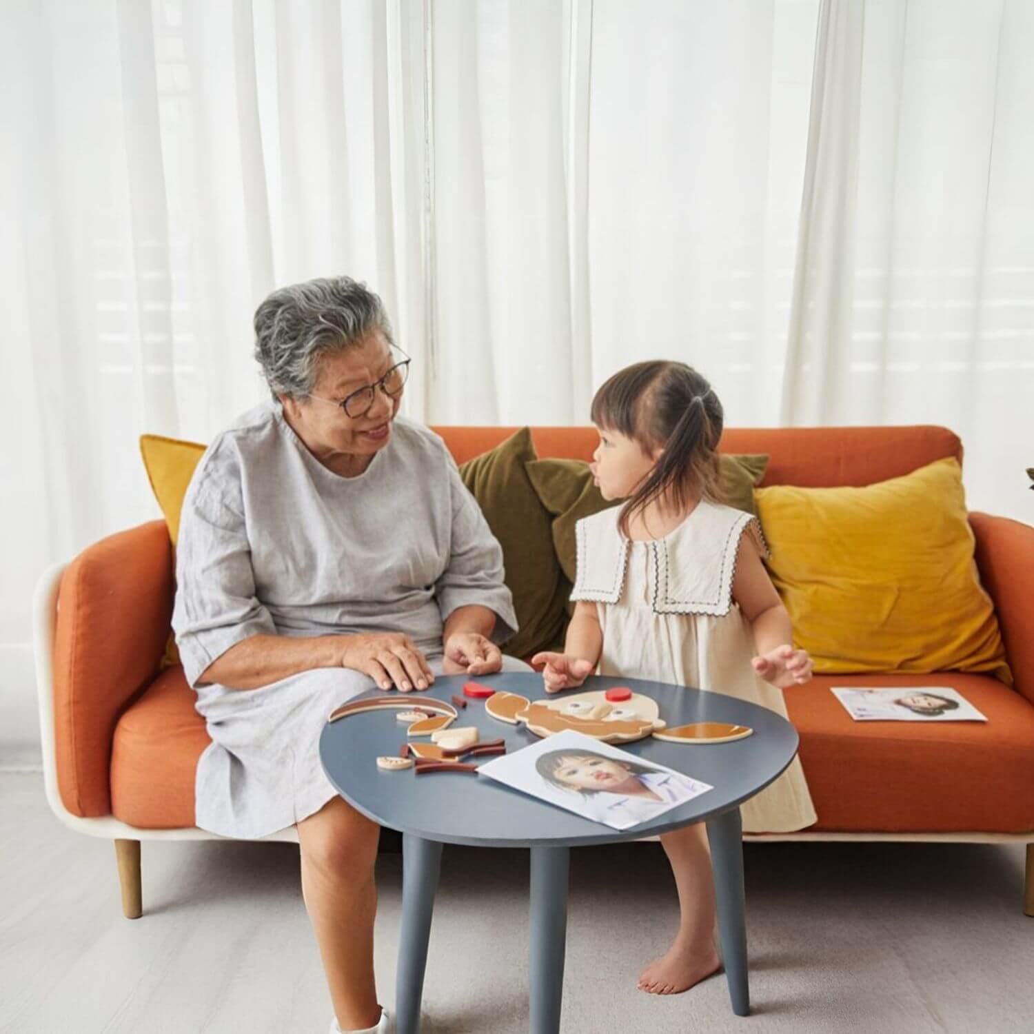 Grandma & Girl Playing PlanToys Build A Face