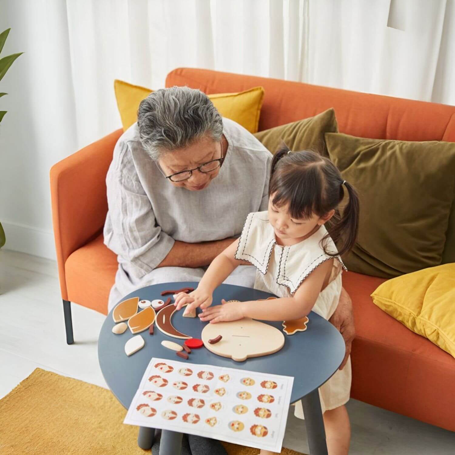 Grandma & Girl Playing PlanToys Build A Face