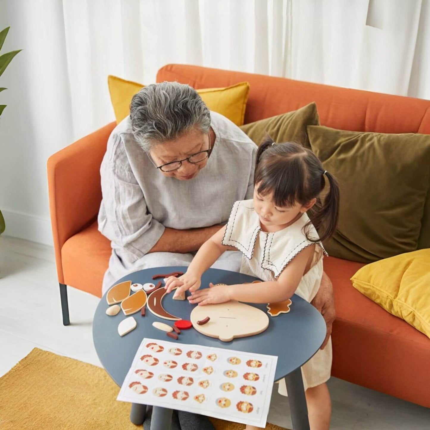 Grandma & Girl Playing PlanToys Build A Face