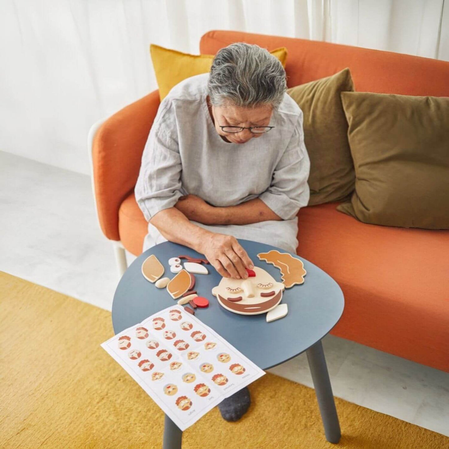 Grandma Playing PlanToys Build A Face