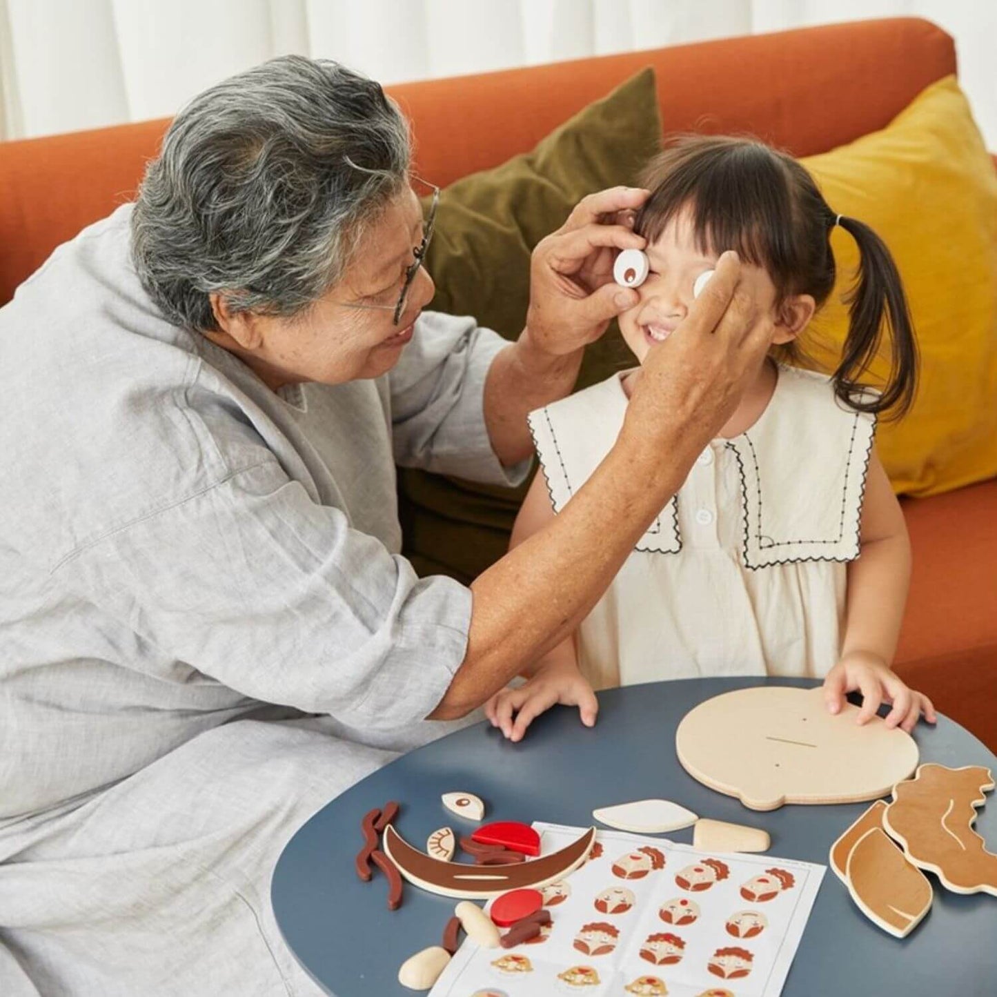 Grandma & Girl Playing PlanToys Build A Face