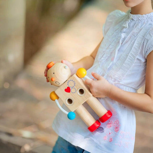 Girl Playing PlanToys Build-A-Robot