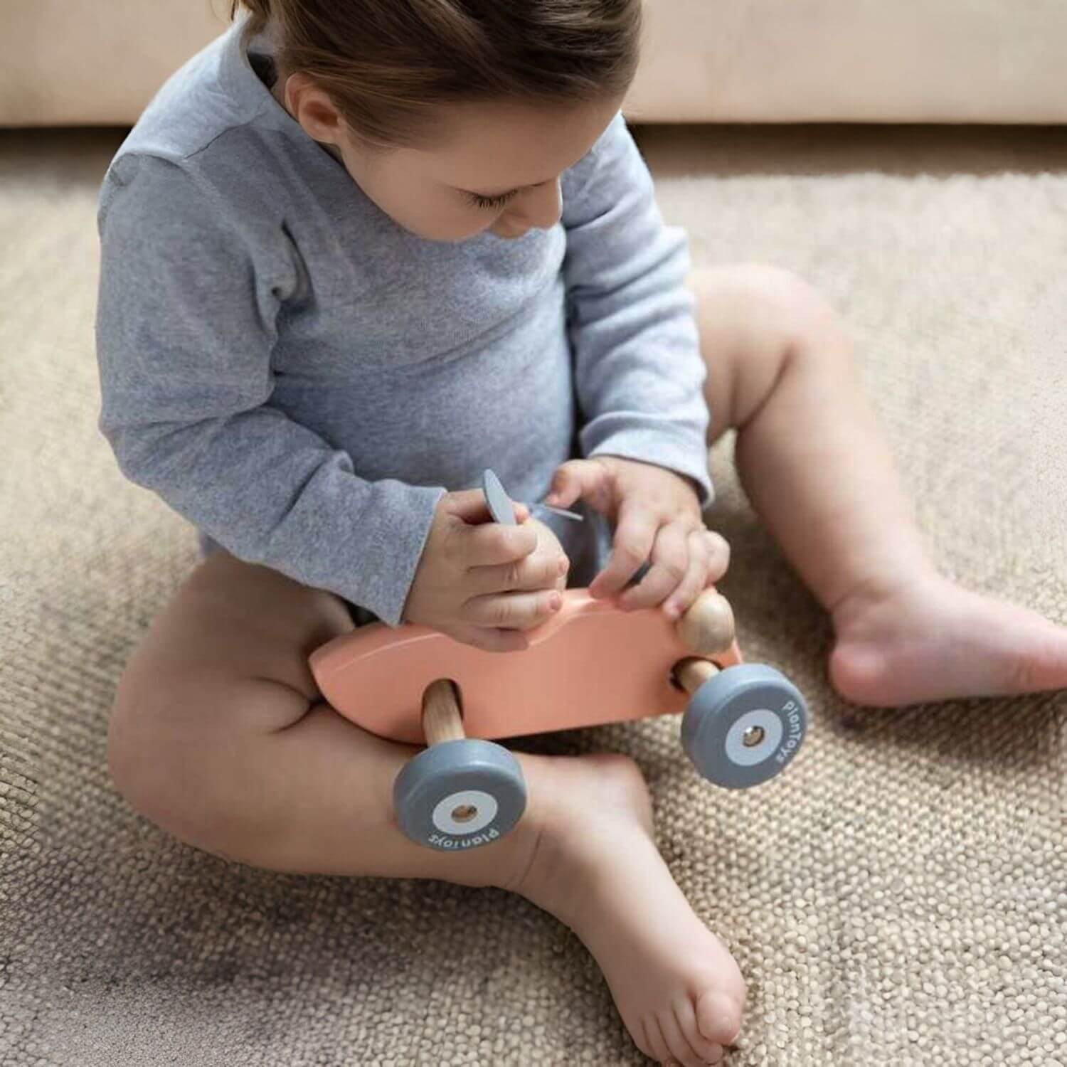 Kid Playing PlanToys Bunny Racing Car