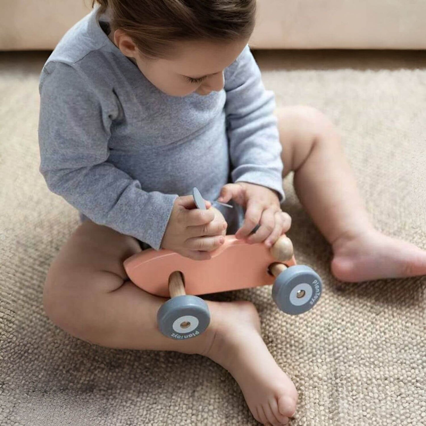 Kid Playing PlanToys Bunny Racing Car