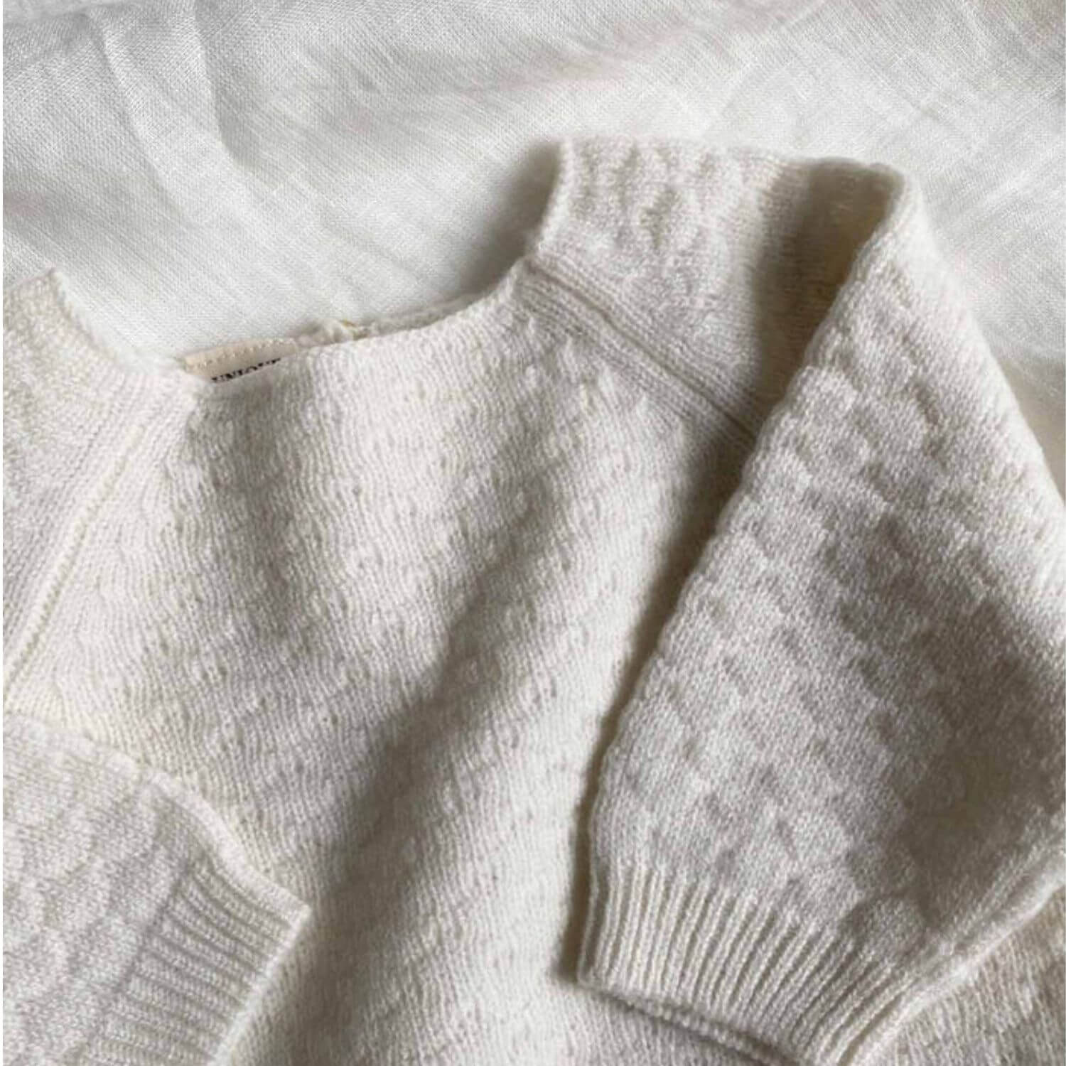 Detail of Unique Love Design Cashmere Baby Sweater Off White