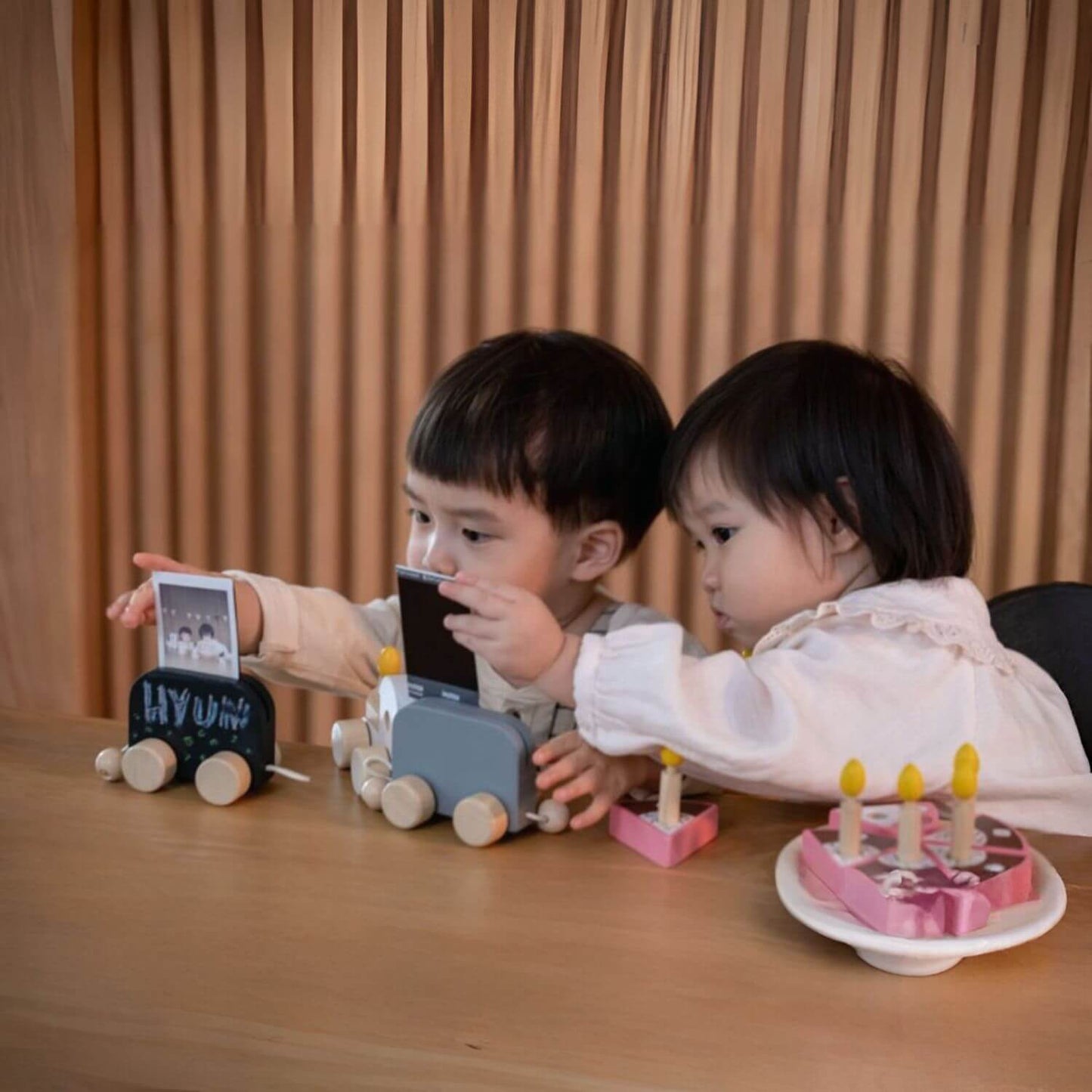 Kids Playing PlanToys Celebration Train