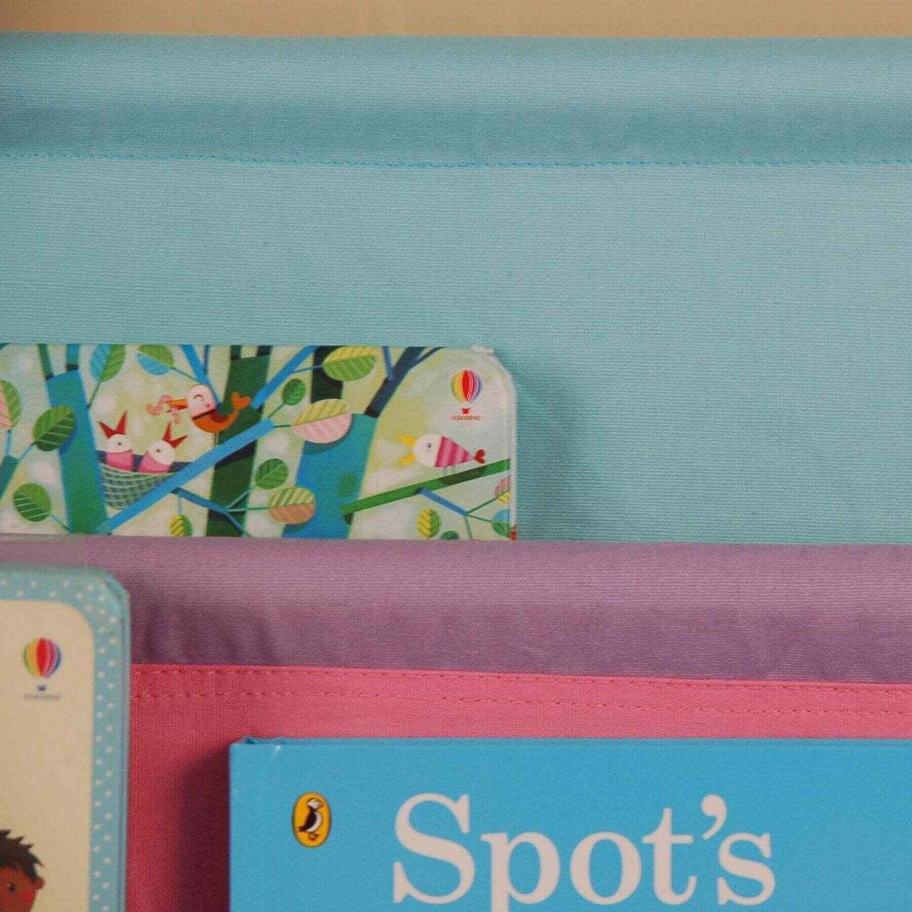 Close-up of Charlie White Kids Wooden Canvas Sling Magazine Bookcase