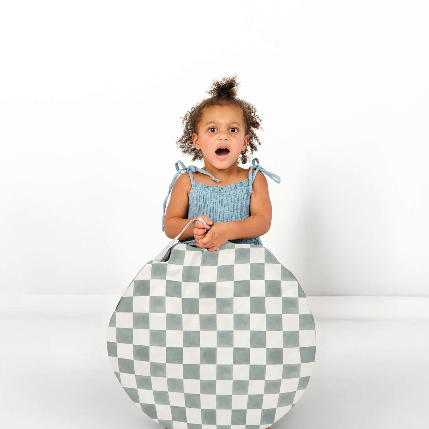 Girl holding a round item