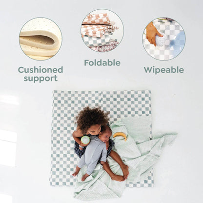Child sitting on a cushion with text highlighting cushioned support, foldable, and wipeable features.